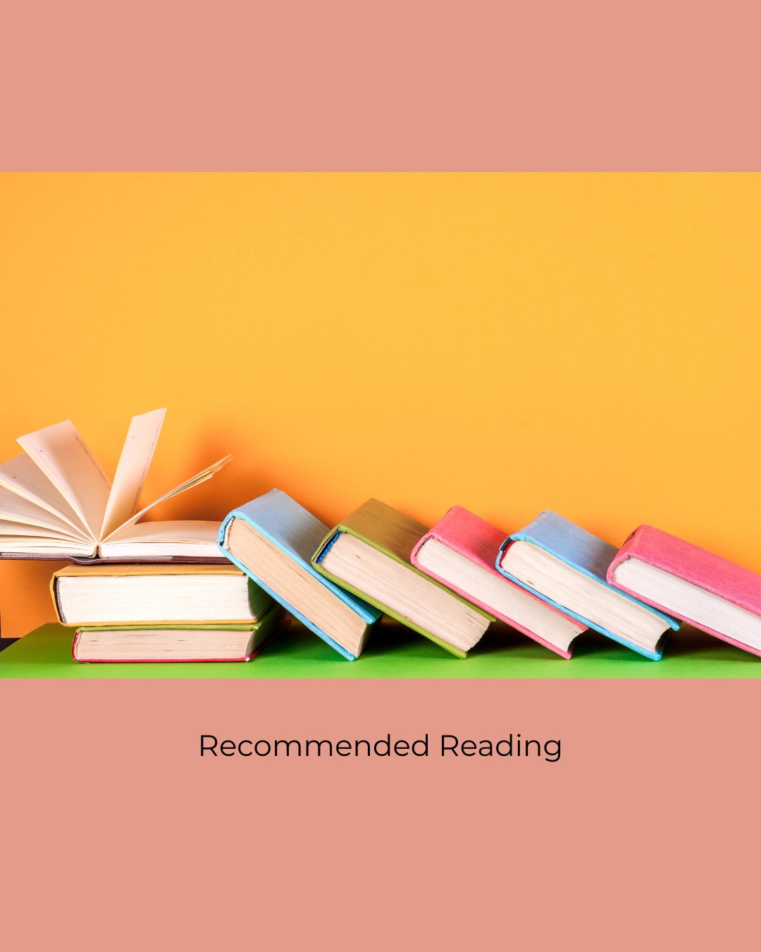 Colourful books leaning in a row against an orange wall, with one open at the end. Caption: Recommended Reading.